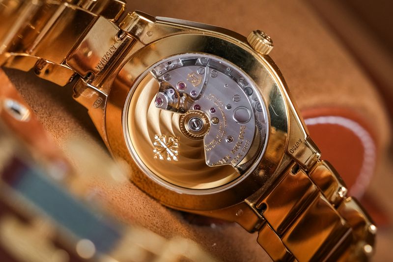 Patek Philippe Twenty Four 18k Rose Gold Diamond 73001200R-001 open autmatic case back with gold rotor